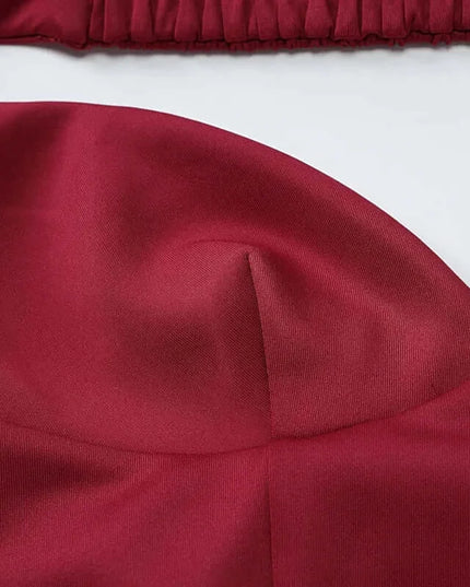 Elegant off shoulder mini dress party with a draped V neck design in deep burgundy showcasing its exquisite fabric and strapless style.