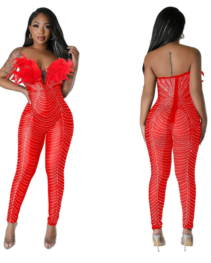 Red jumpsuit with white pattern worn by a model on a gray background