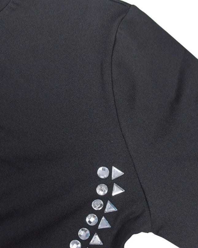 Black garment with geometric embellishments on a white background