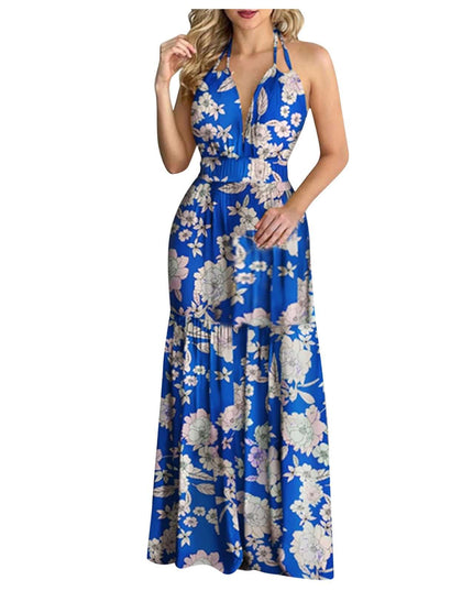 Women in a tropical print halter backless maxi dress with deep V neckline, perfect beachwear for summer.