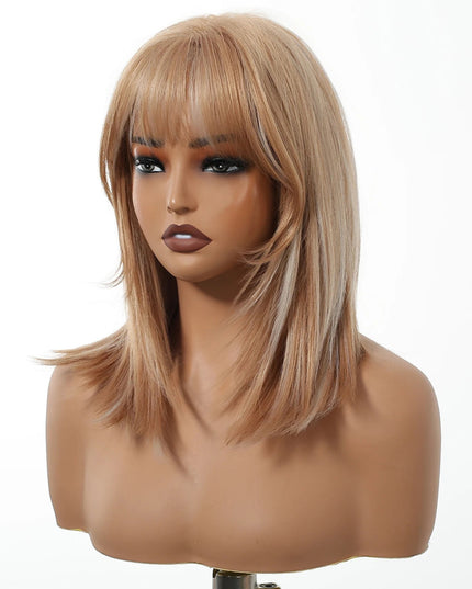 Blonde wig with bangs on a mannequin head against a white background