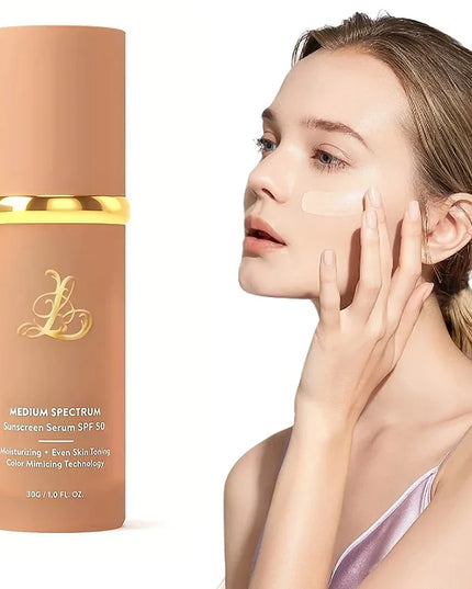 Woman applying sunscreen to her face with a bottle of sunscreen serum in the foreground.