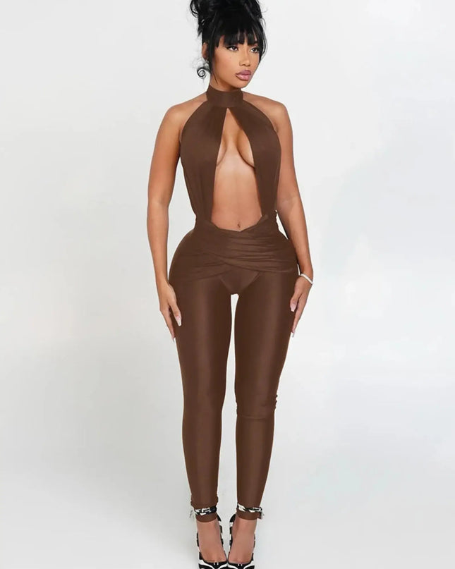 Woman wearing a brown leather jumpsuit on a white background