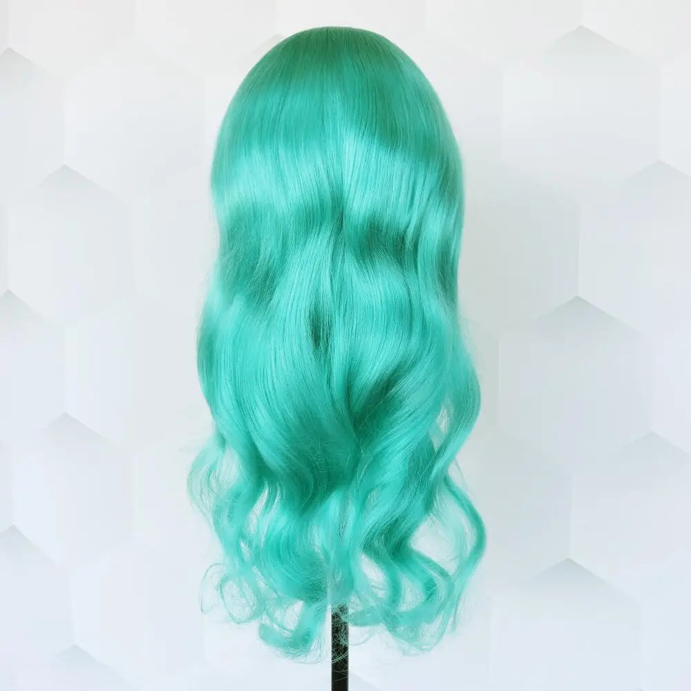 Teal wig on a mannequin head against a light background