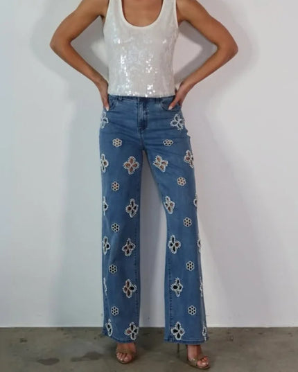 Casual hollow out women’s jeans loose straight style with floral embroidery, perfect for trendy urban outfits.