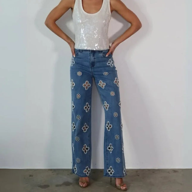 Casual hollow out women’s jeans loose straight style with floral embroidery, perfect for trendy urban outfits.