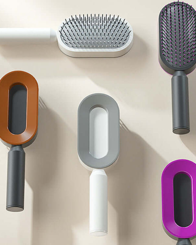 Set of pet grooming brushes with different handles on a beige background