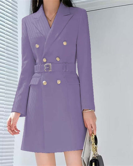 Purple coat with gold buttons worn by a person, standing against a light gray background.