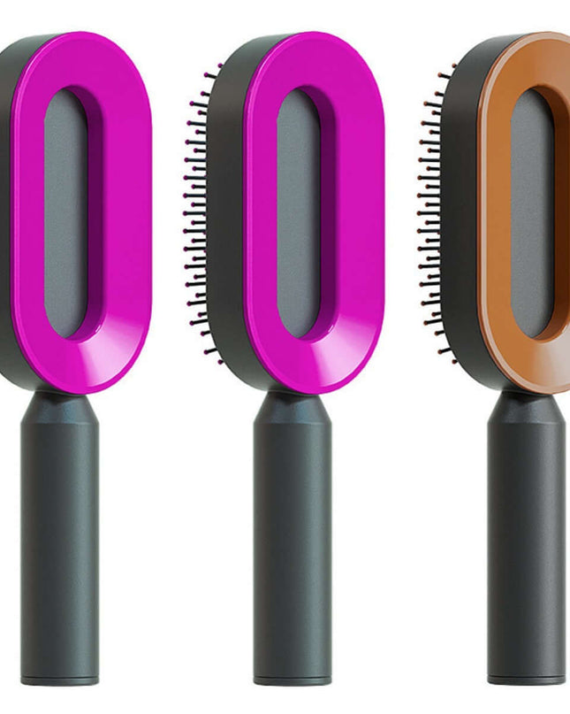 Three pet grooming brushes with pink, gray, and brown handles on a white background