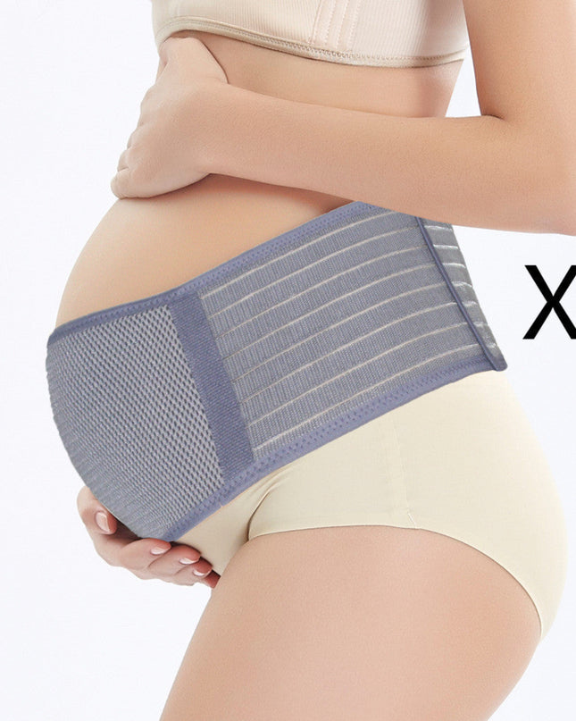 Pregnant woman wearing a blue and gray abdominal support belt on a white background