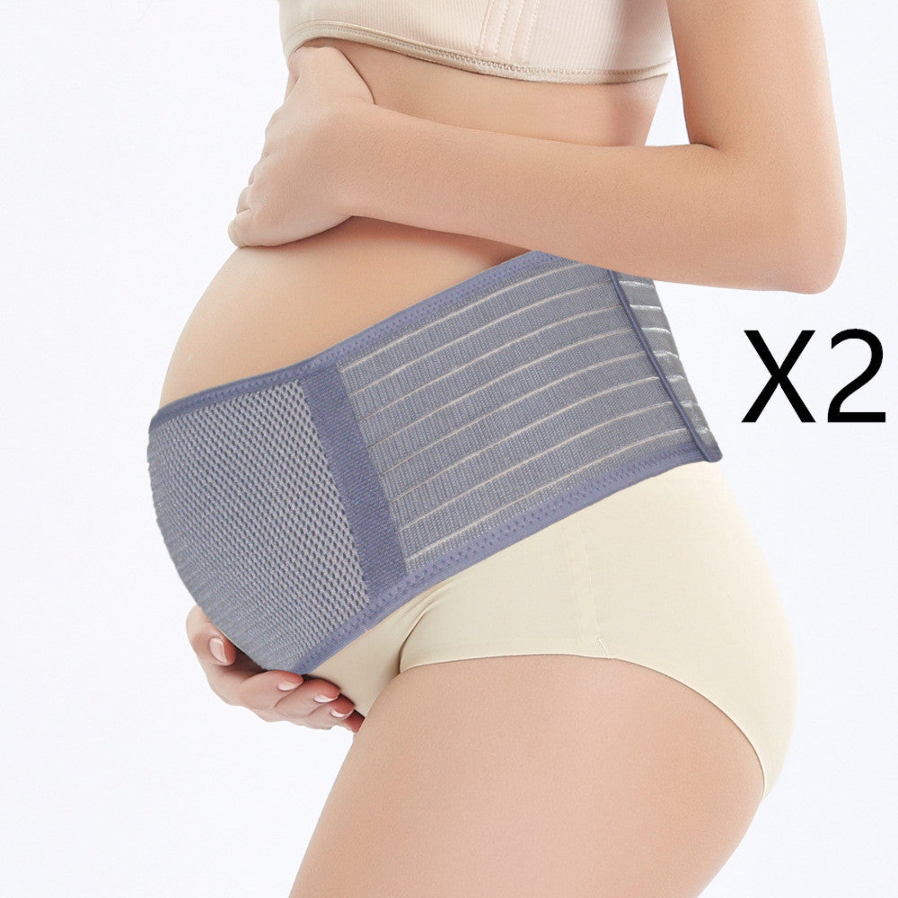 Pregnant woman wearing a blue and gray abdominal support belt on a white background