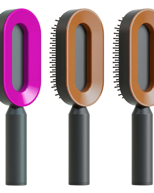 Three hairbrushes with different color handles on a white background