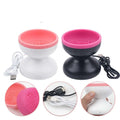 Two silicone cupping devices, one pink and white, one black and pink, with USB cables on a white background.
