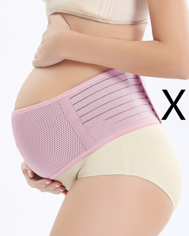 Pregnant woman wearing a pink maternity belt on a white background