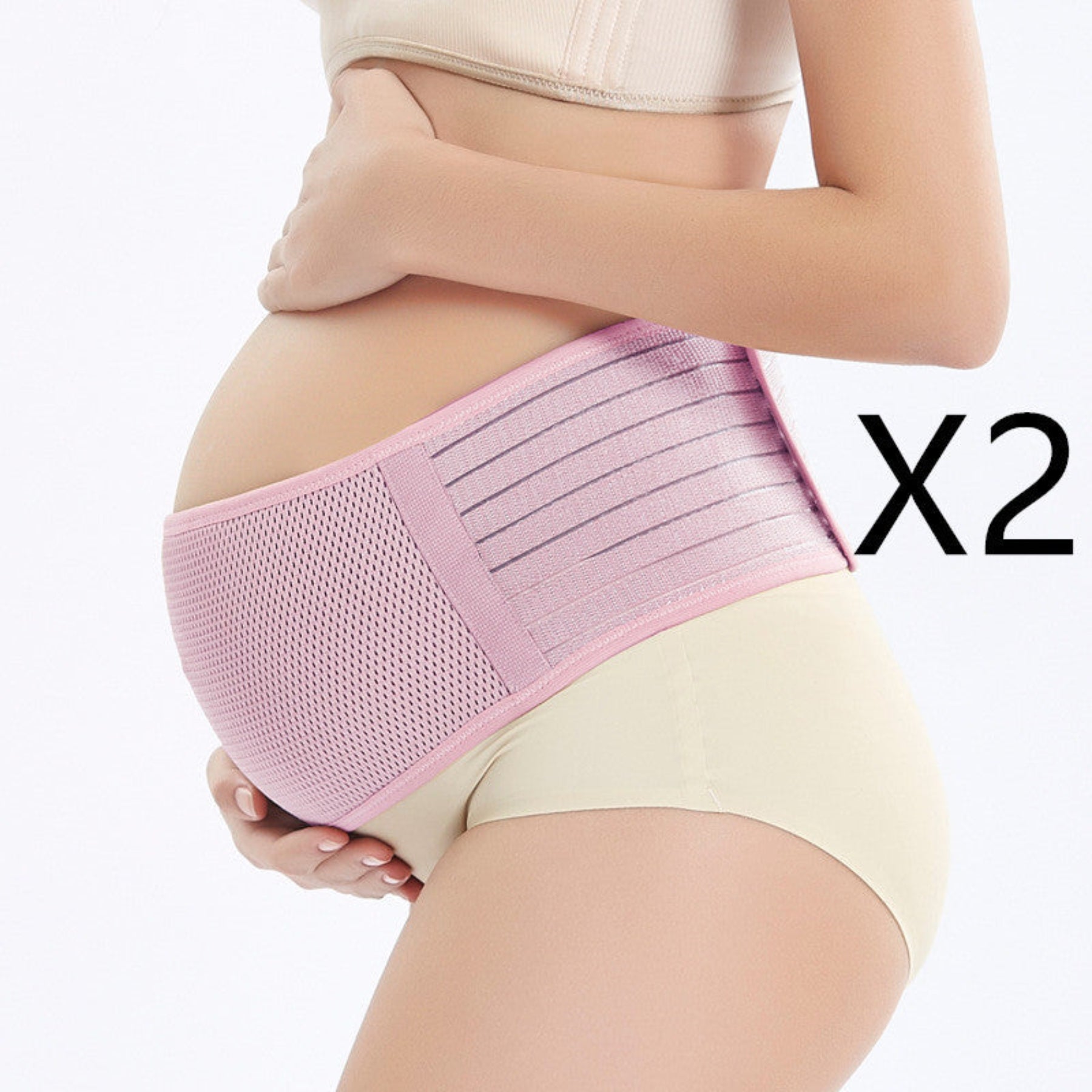 Pregnant woman wearing a pink maternity belt on a white background