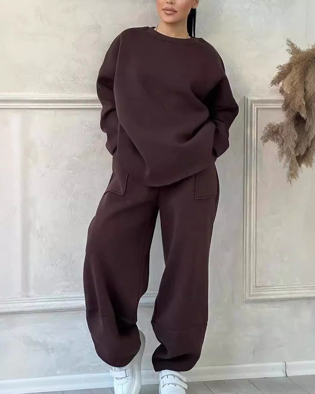 Women's autumn winter sweater trousers set in dark brown color, featuring a loose round neck and pocket details.