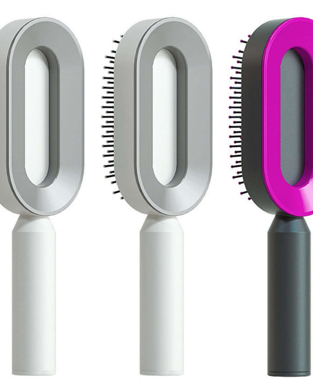 Three grooming brushes with different handle colors on a white background