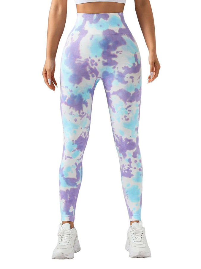 Multicolored tie-dye leggings worn by a person on a plain background