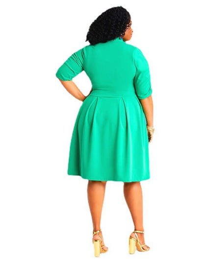 Woman wearing a green dress on a white background