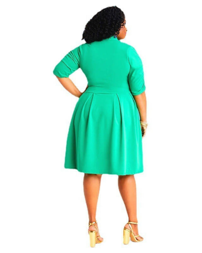 Woman wearing a green dress on a white background