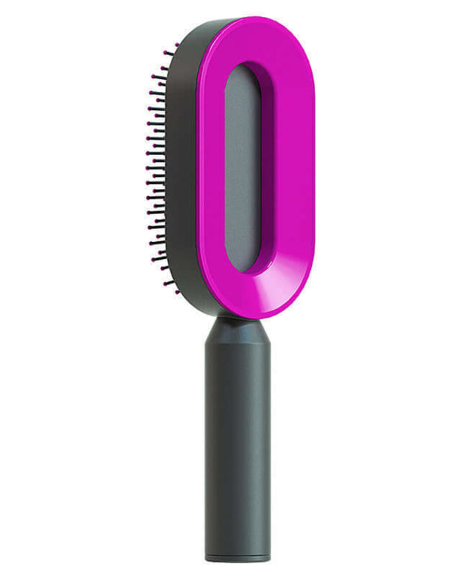 Pet grooming brush with pink handle and gray body on a white background