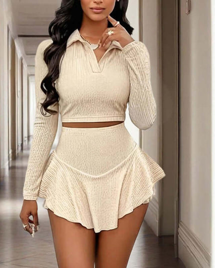 Women's beige solid color lapel crop top with asymmetrical ruffle skirt, suitable for spring and fall vacation outfits.
